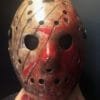 Front view of the bloody Freddy vs Jason mask showing intense red blood splatter and intricate hand-painted textures.