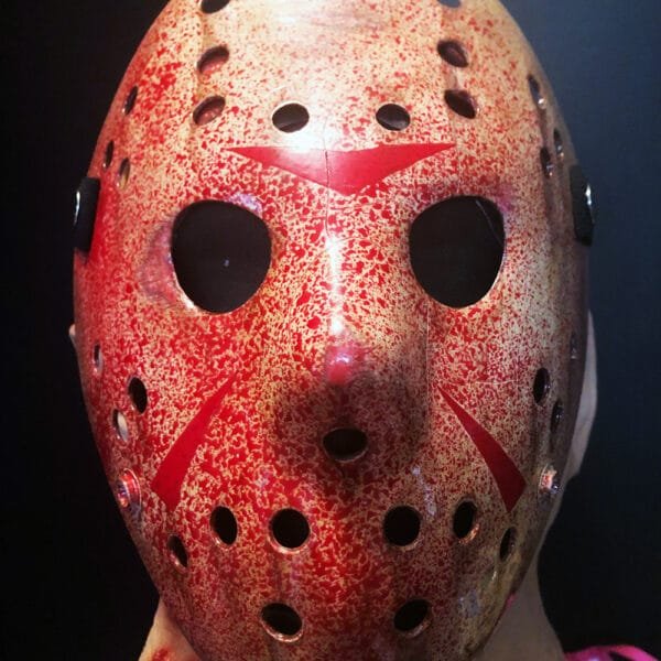 Front view of the Bloody Version Friday the 13th Part 3 Mask drenched in a blood-splatter effect.