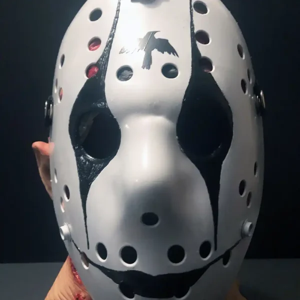 Front view of The Crow Hockey Mask featuring the iconic black-and-white design