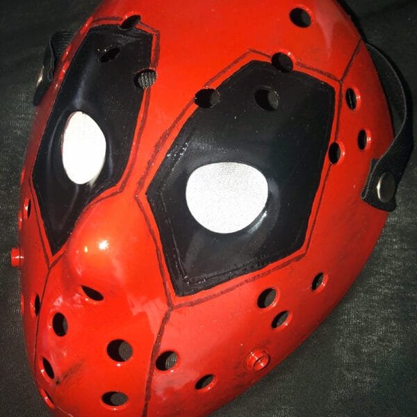 Close-up view of the Deadpool hockey mask detailing hand-painted features.