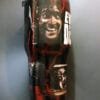 Close-up of Ash Williams on the Evil Dead tumbler as he descends into insanity.