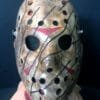 Front view of the Freddy vs Jason mask, featuring hand-painted weathered details, red chevron accents, and a distressed hockey mask design.