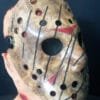 Angled close-up of the Freddy vs. Jason mask highlighting its hand-painted textures, deep slashes, and weathered appearance.