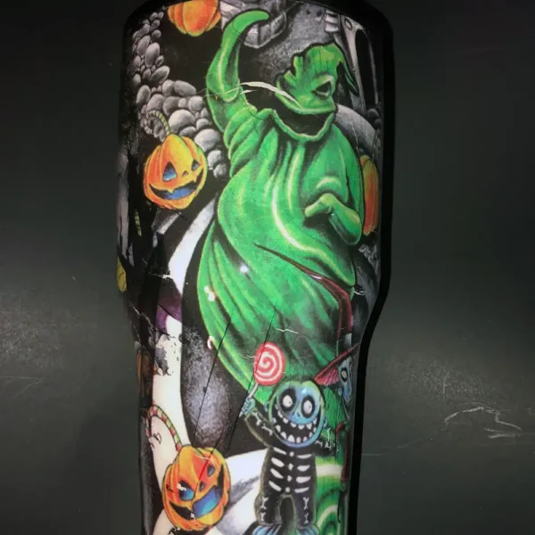 Oogie Boogie and Halloween pumpkins are featured on the side of the vibrant tumbler.