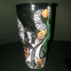 Rear view of the tumbler highlighting additional pumpkins, candy canes, and eerie designs