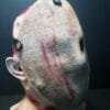 Side view of the Friday the 13th Part 2 Mask showing straps and burlap texture