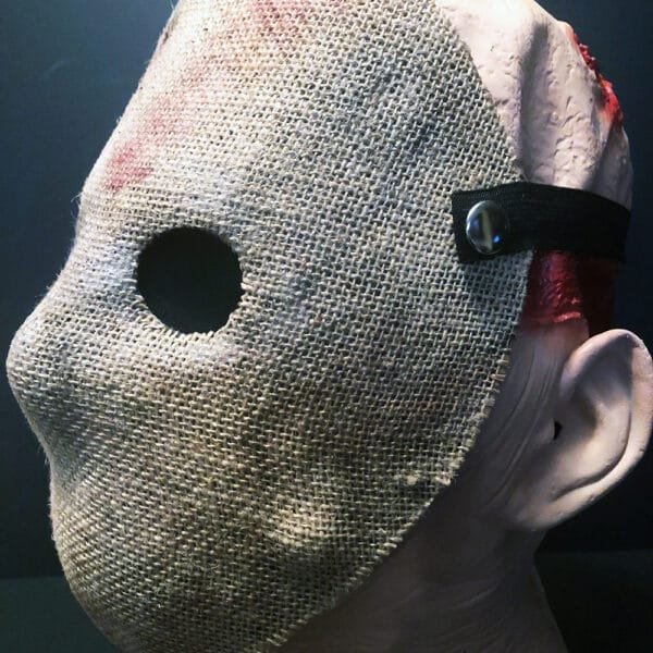 Close-up of Friday the 13th Part 2 Mask with single eyehole and weathered burlap details