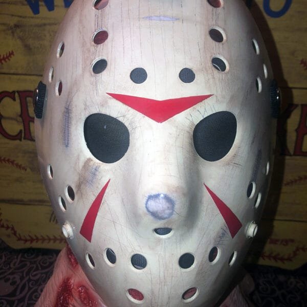 Front view of the Clean Version Friday the 13th Part 3 Mask with light weathering and red chevrons.