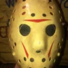 Front view of Friday the 13th Part 8 Mask showing yellowed weathered surface and red chevrons.