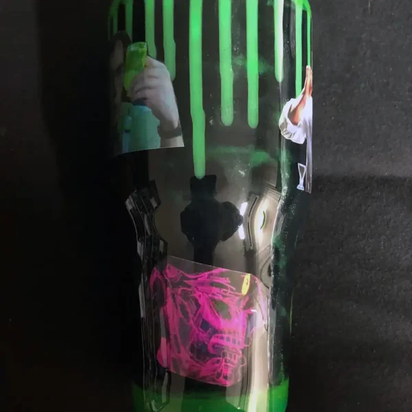 Side view of the tumbler highlighting the pink brain and glowing serum.