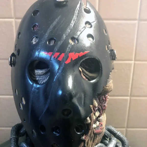 Front view of the Savini Jason Mask featuring jagged scars, red markings, and undead textures.