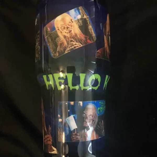 Tales from the Crypt tumbler featuring Crypt Keeper and spooky scenes, front view