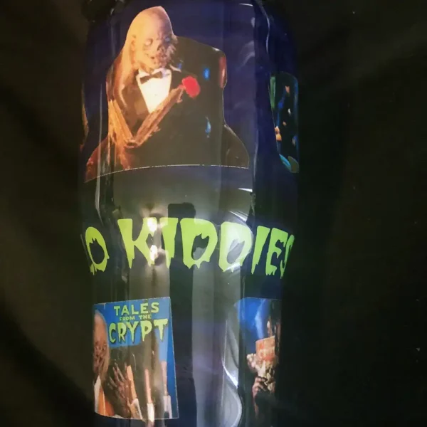 Side view of Tales from the Crypt tumbler with iconic Crypt Keeper artwork