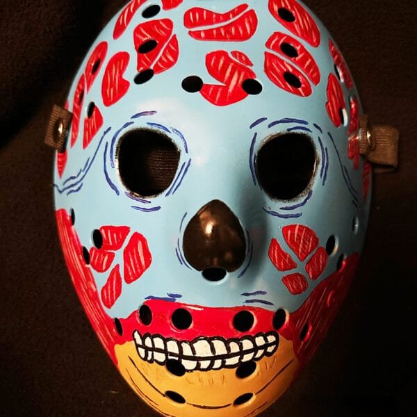 hey Live Hockey Mask featuring a vibrant blue base with red alien details and a yellow jaw.