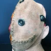 Alternate side view of the Sam Trick r Treat mask, showing removable elastic straps.