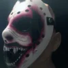 Profile view of WWE The Fiend Hockey Mask displaying red and black streaks, sinister grin, and detailed craftsmanship on white ABS plastic, against a dark background.